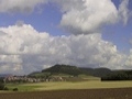 Baviera - ( campi arati, cielo azzurro con nuvoloni, paese bavarese )
